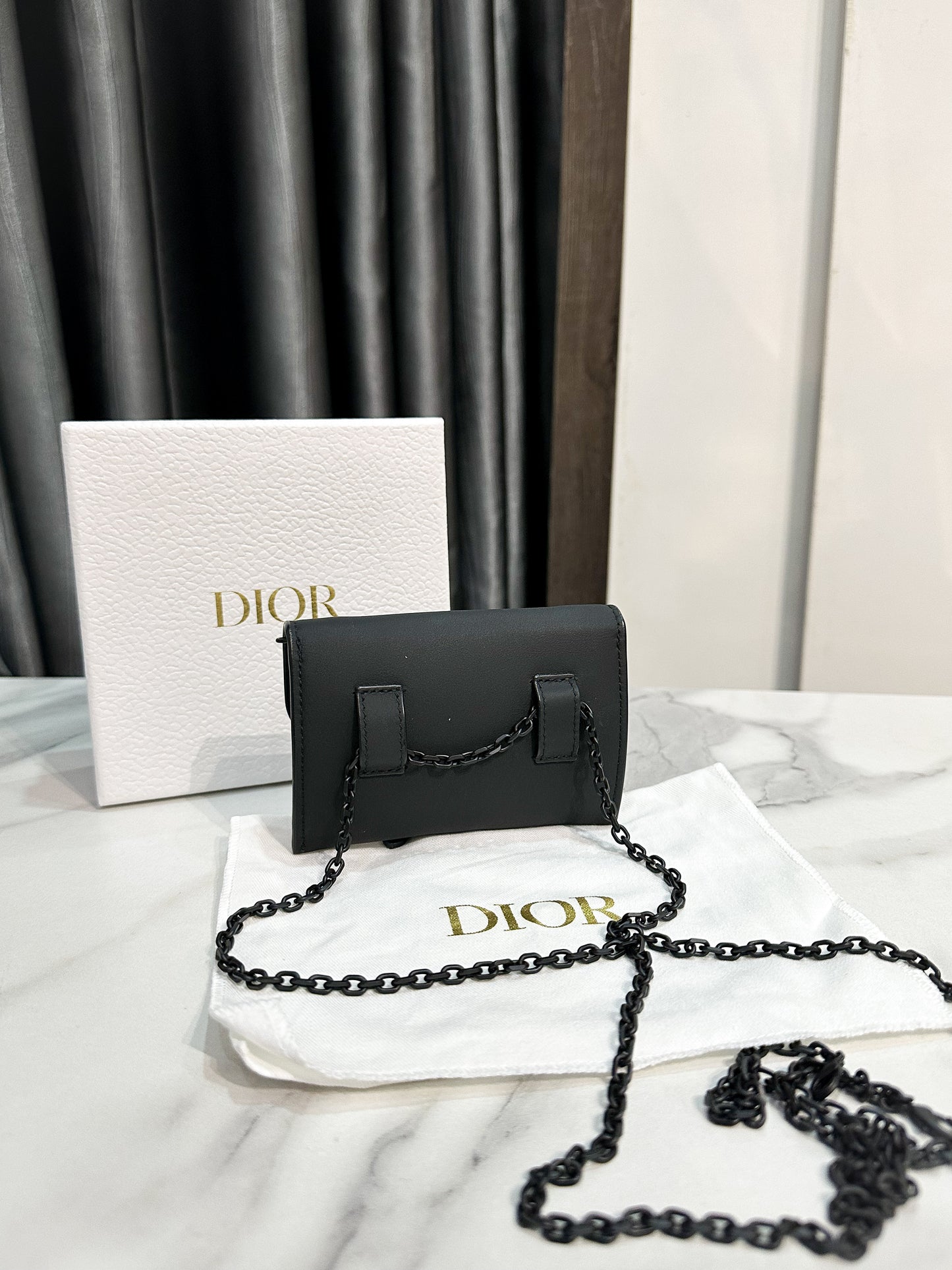 A Dior Nano Saddle Chain Pouch